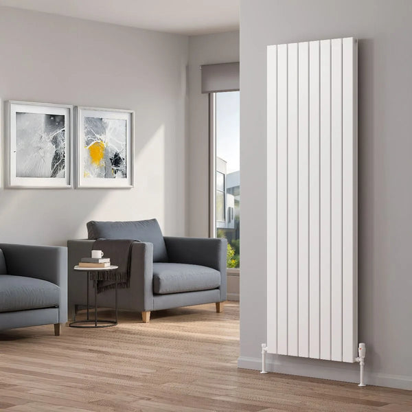 Reina Piatto vertical aluminium radiator in white in a light grey living room with armchairs