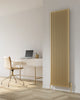 Reina Albano 1800 x 510mm brass aluminium vertical radiator in a home office