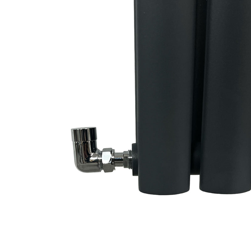 Black cylindrical radiator with a chrome elbow valve on a white background