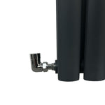 Black cylindrical radiator with a chrome elbow valve on a white background
