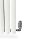 White radiator with a silver valve on a white background